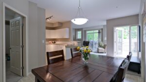 Room With a Wood Table and 4 chairs, large window